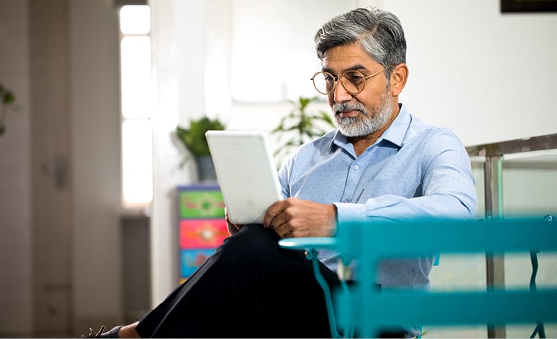 Man sitting with a tablet 